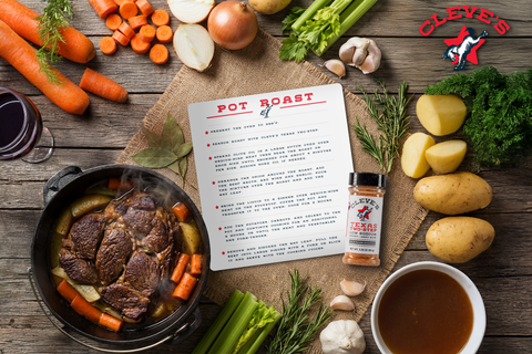 Dutch oven of Cleve's pot roast with carrots and potatoes, surrounded by fresh vegetables and a bottle of Texas Two-Step all-purpose seasoning.